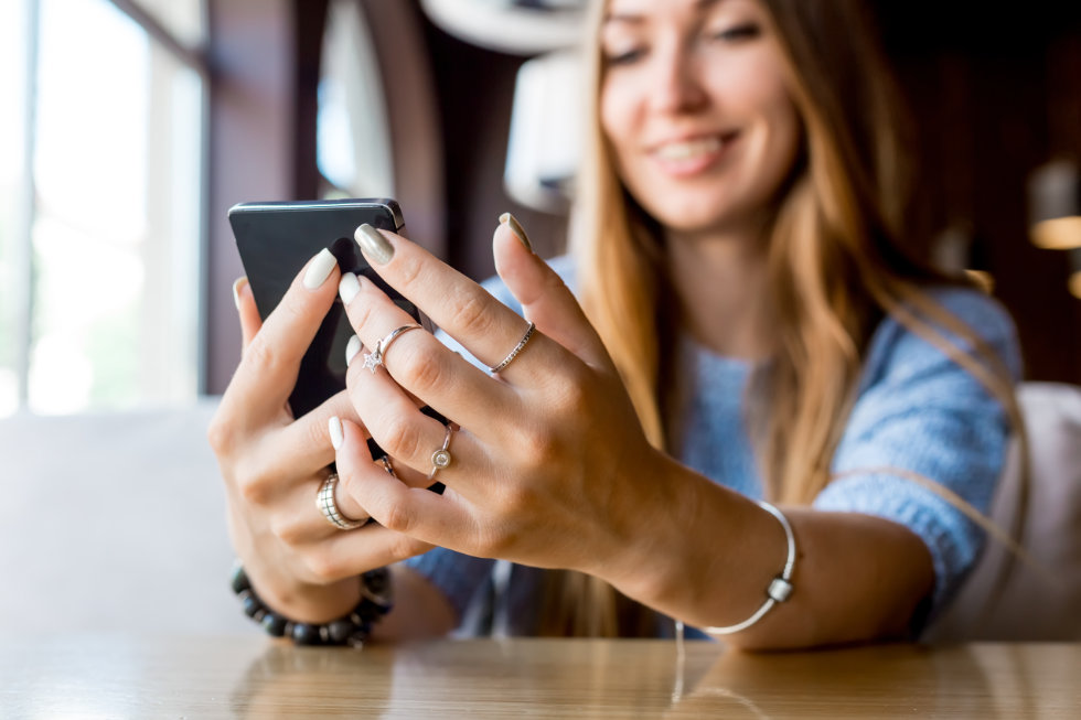 woman holding cell phone - right to privacy - privacywe